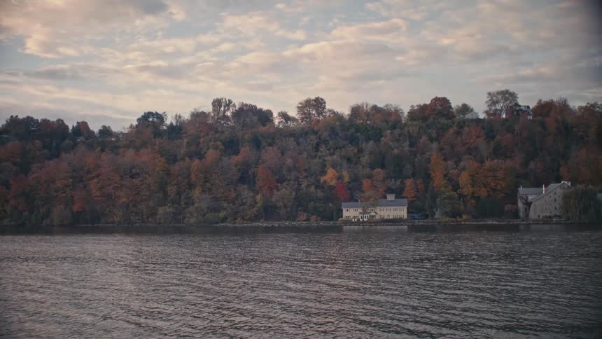 Houses are displayed on a the coast of a lake