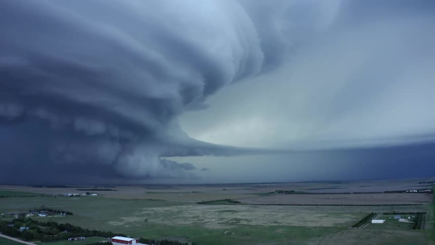 Real time aerial shot of the Imperial Nebraska Mothership severe supercell thunderstorm as lightning strikes in the upper right corner
