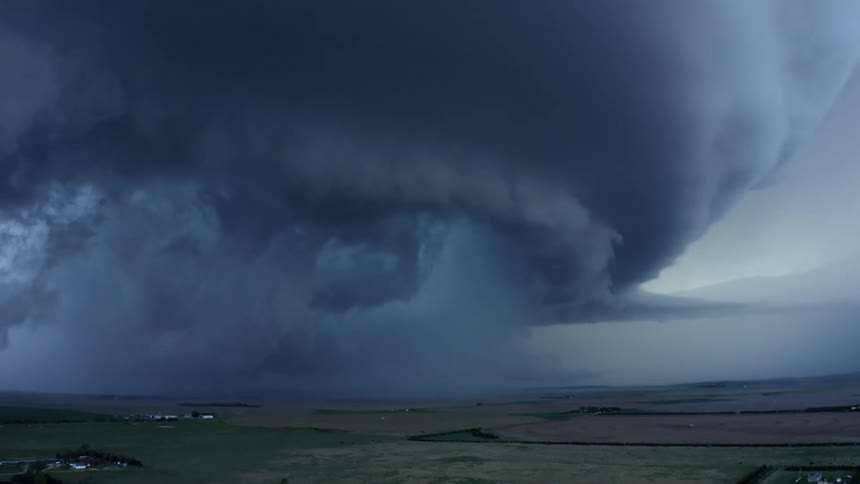 Aerial time lapse of the Imperial, Nebraska Mothership severe weather supercell thunderstorm blowing and overwhelming the rural farmland in this once in a lifetime weather moment