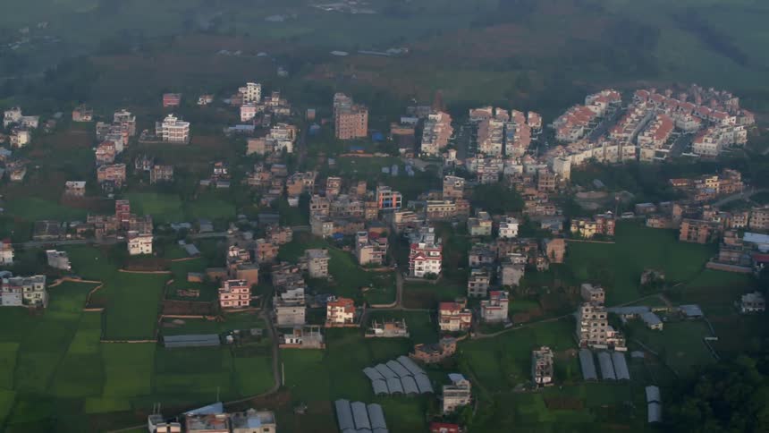 A city surrounded by trees