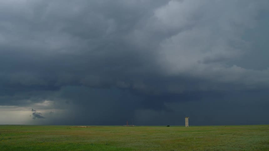 Time lapse of an intense cloudburst supercell thunderstorm swirling and forming over a grassland prairie in the northern Texas panhandle