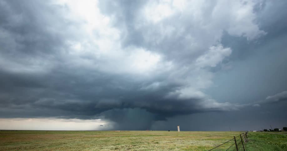 Wide time lapse of a cloud burst rain event as the super cell storm moves towards camera