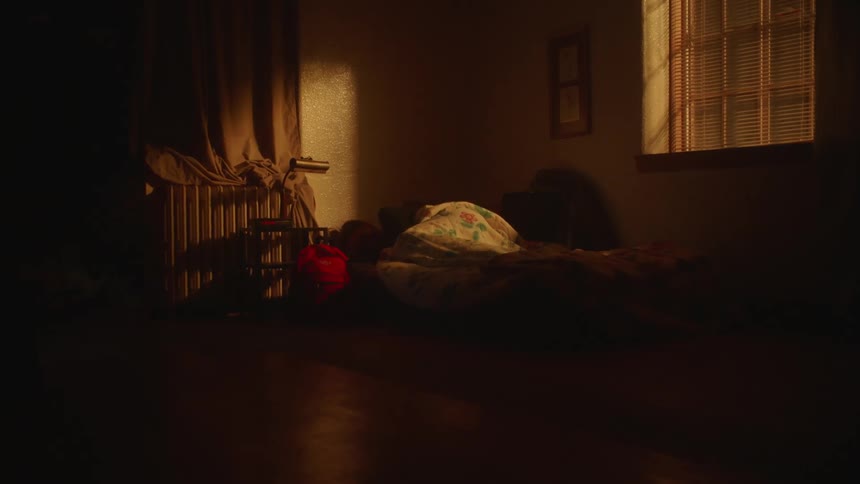 A person is sleeping at night in the bed