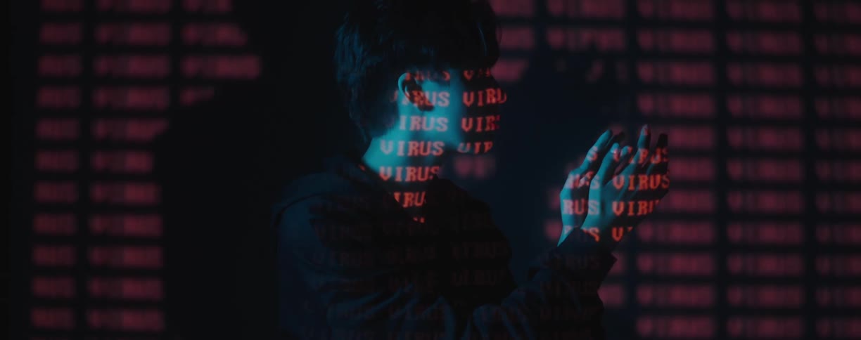 Font reflects on a teenager who moves their hands in front of their face and examines them