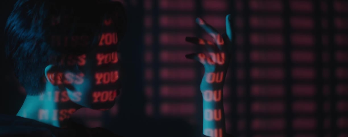 A person is in a room with text on them
