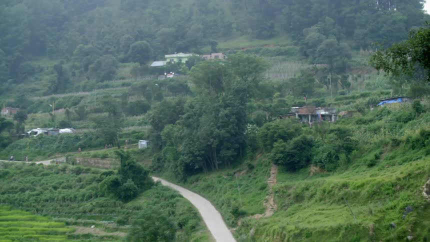 Aerial view of a hilly area with some homes
