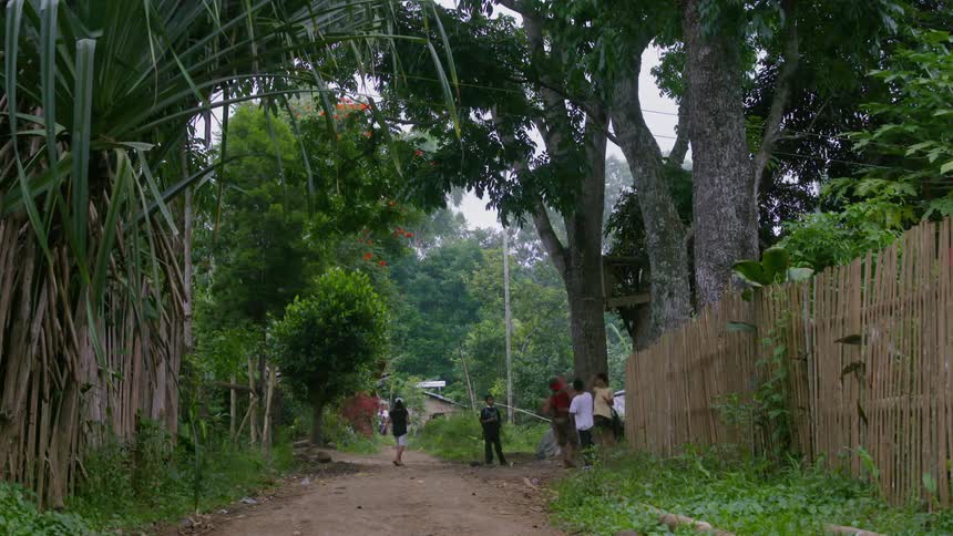 Children are playing on a dirt path