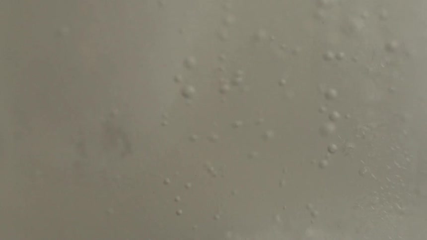White foamy liquid moving with bubbles