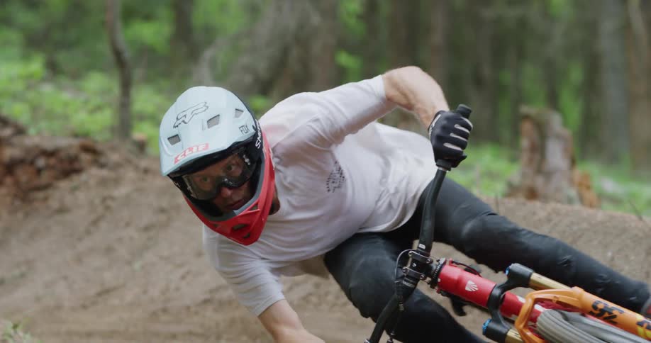 A man biking down a trail