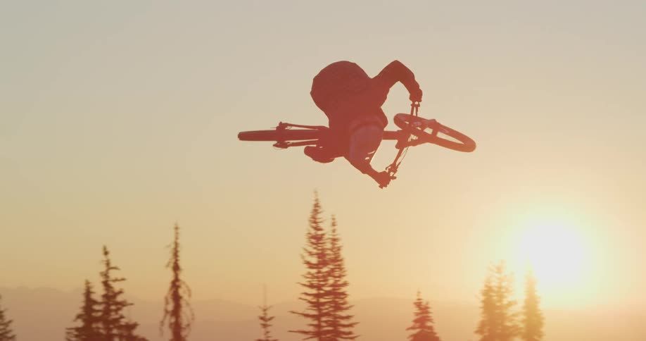 A person on a dirt bike doing a stunt
