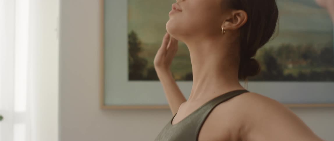 A young woman exercising at home