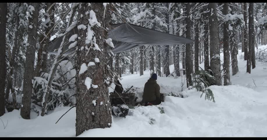 A man setting up a campsite