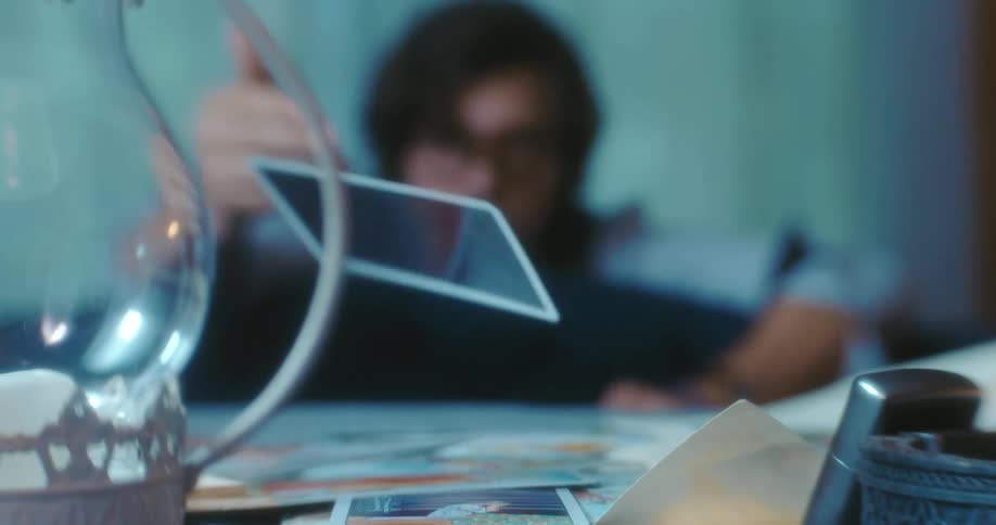 A man is throwing cards on the table