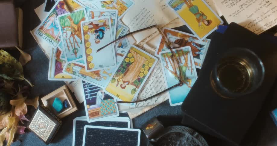 A person throws cards on to a table