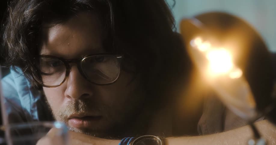 A man is sitting in a room