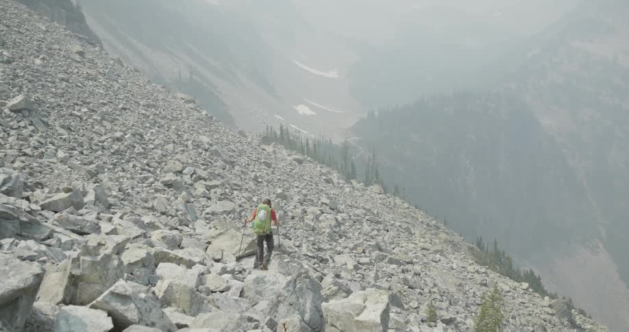 A man hiking on a mountain range