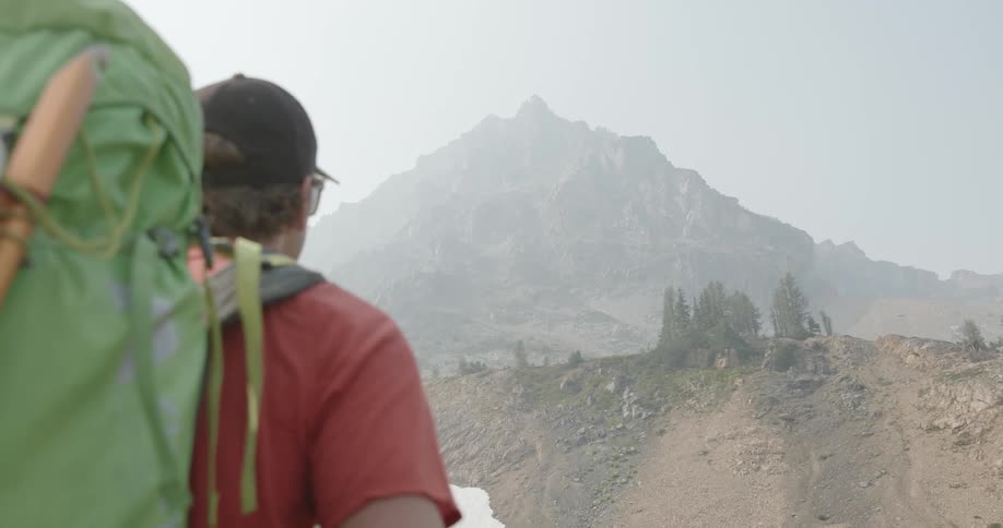 A hiker looking at the mountain ahead