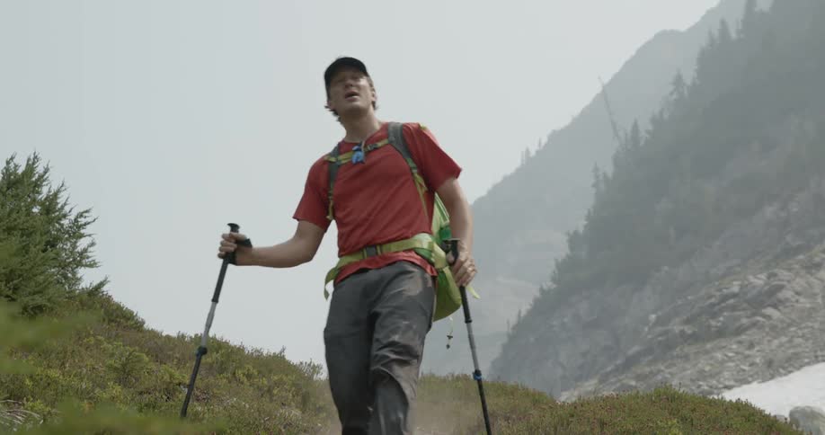 A man hiking through a mountain range