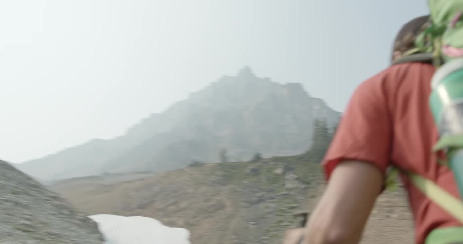 A man is hiking up a mountain