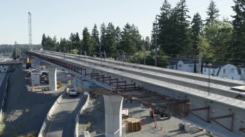 Parallel traverse along a new support structure for light rail train tracks being built next to an expressway