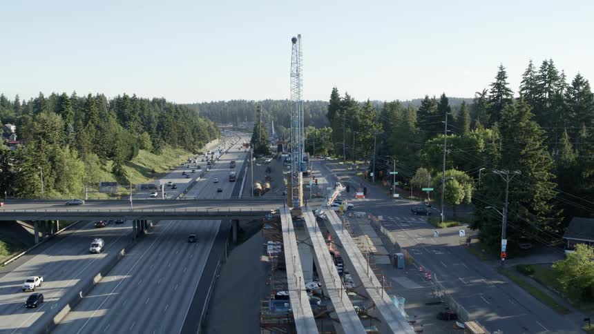 Revealing new light rail construction and equipment along a busy freeway