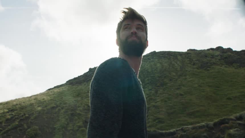 A man looking up a hill
