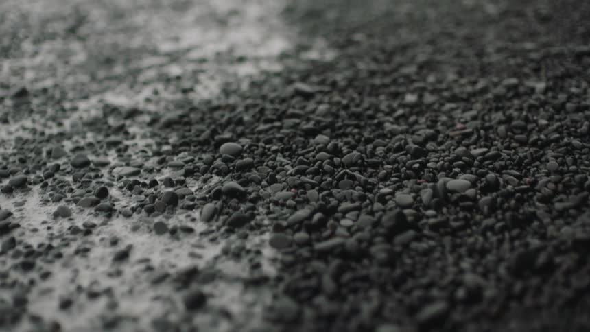 Rain falling on pebbles