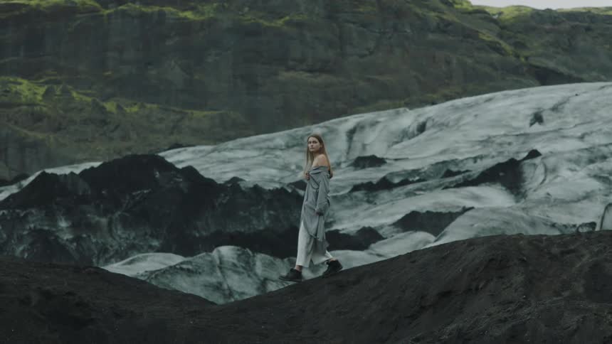 A woman walking down a hill