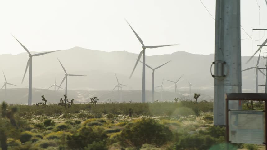 Wind turbines spinning on a wind farm
