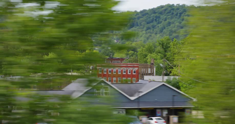 Colorful small buildings on a rural small town in the mountains at day