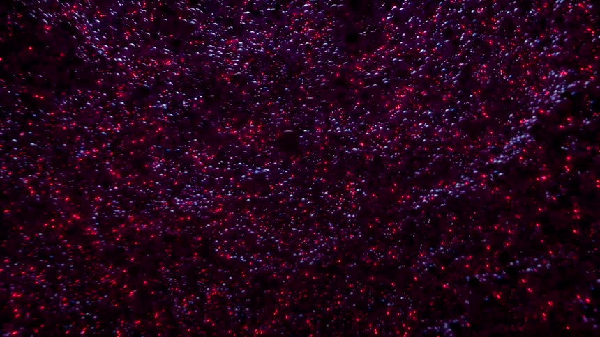 Red lights with abstract shapes and balls in purple and blue moving