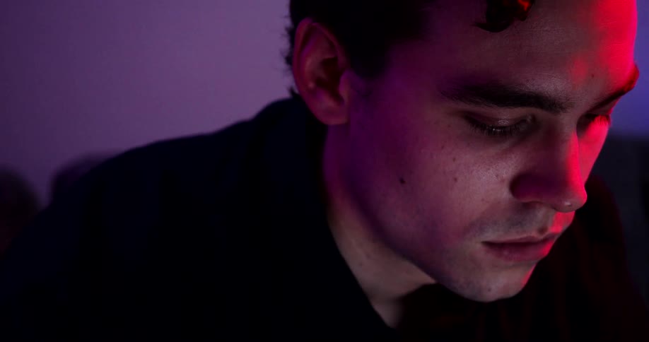 A man is sitting in a room