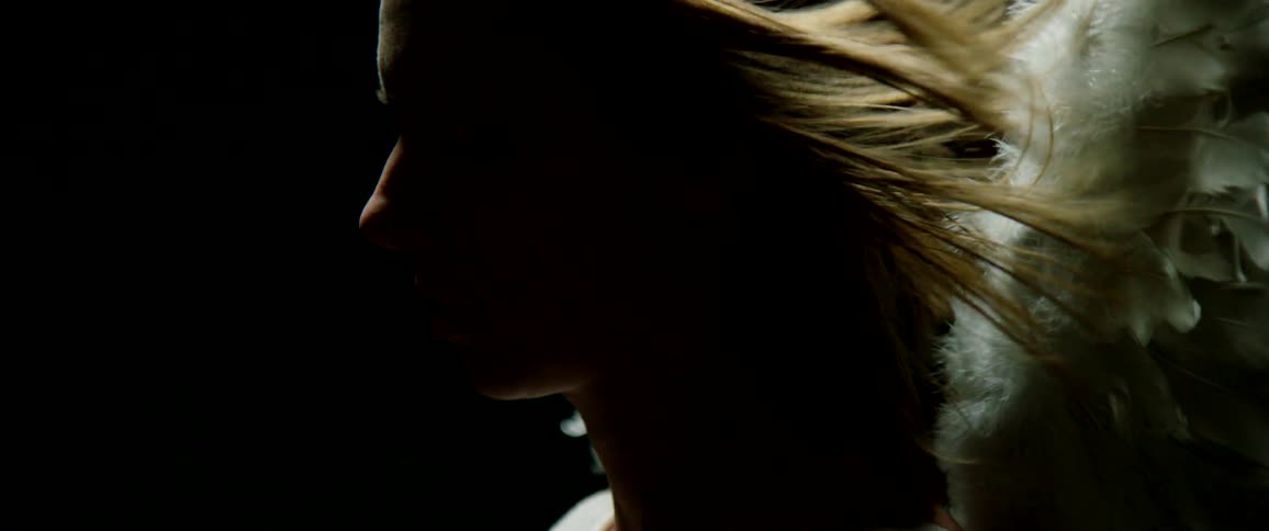 A womans hair is blowing in the wind