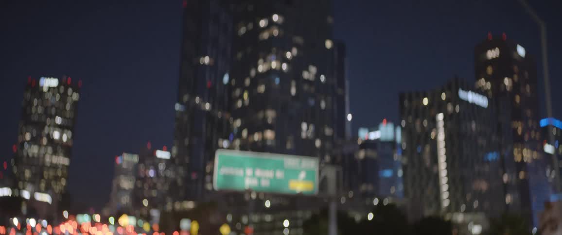 A view of a downtown city is displayed at night