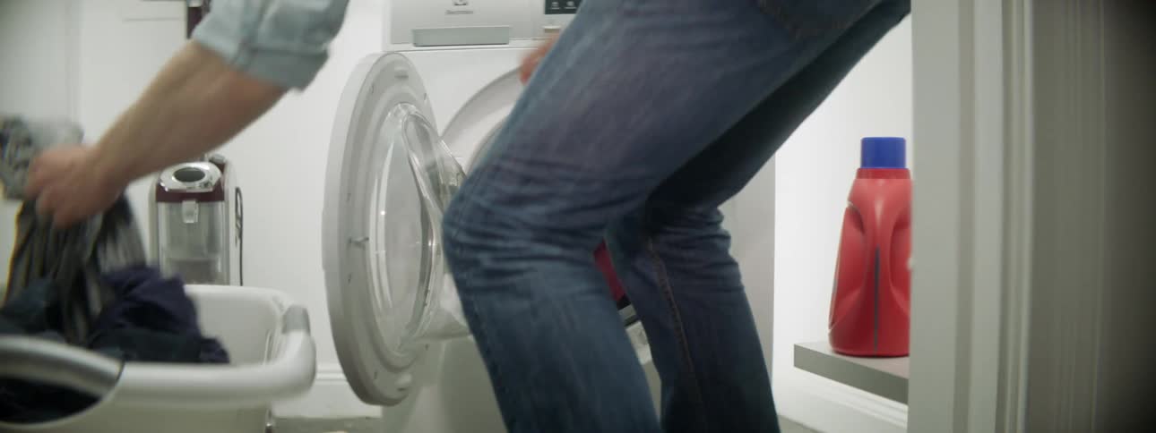 Loading dirty clothes into a front loading washing machine