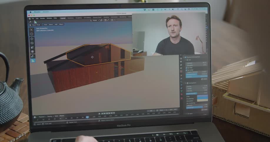Architect designing a home during a video call on a laptop from home
