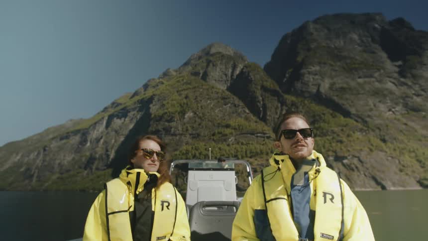 People travelling across a lake in a boat