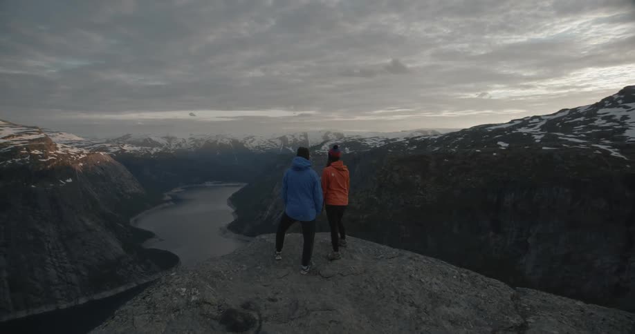 Two people standing on a cliff