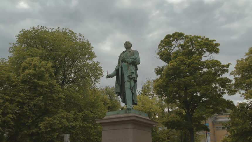 A statue in a wooded area