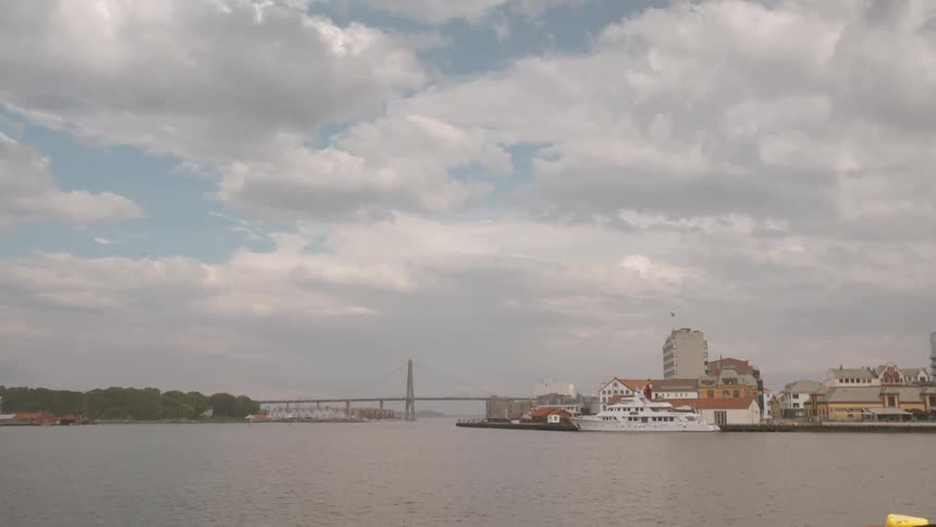 A waterside city on a cloudy day
