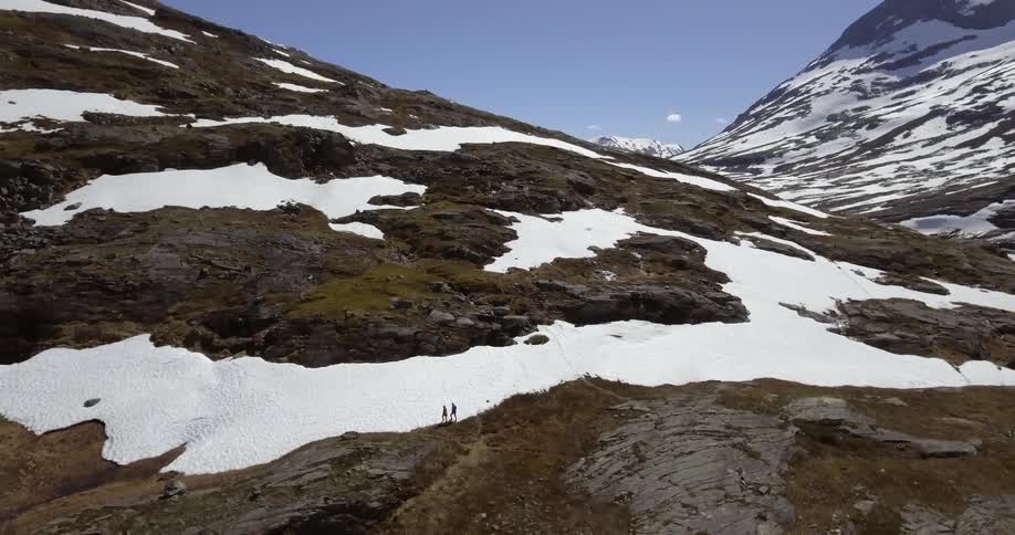 A snow covered mountain during the day