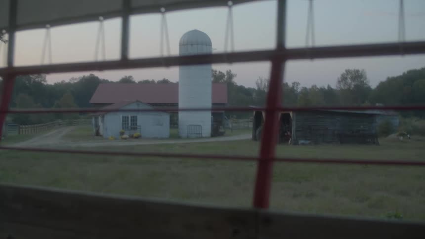 A house and barn on farmland