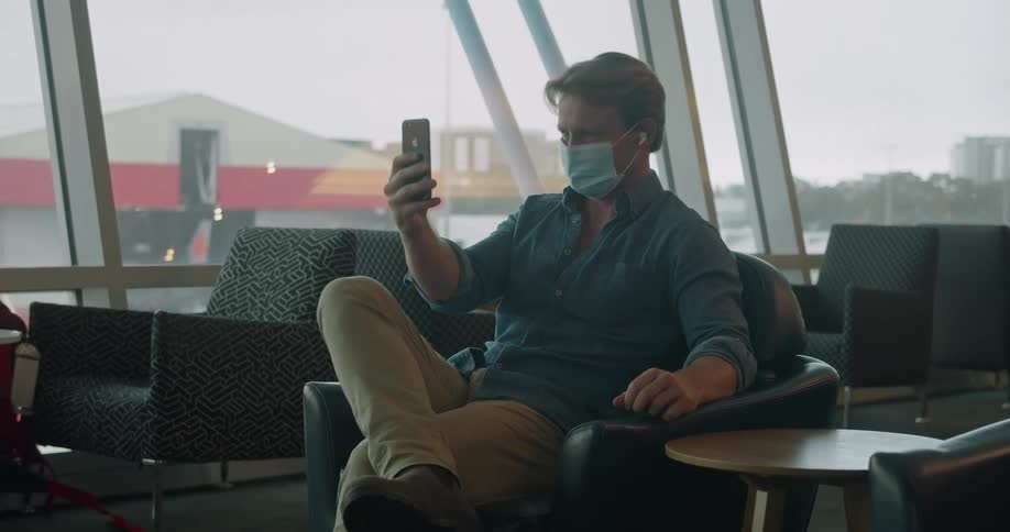 A man using a phone to video call