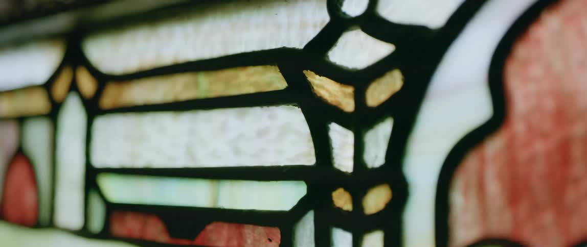 Close up of a colorful stained glassed window pane