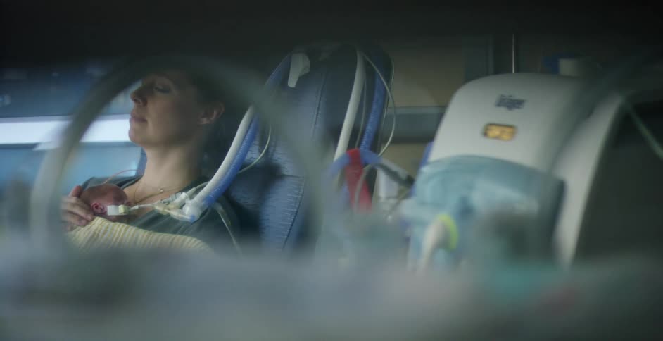 A peeping shot of a woman in a hospital