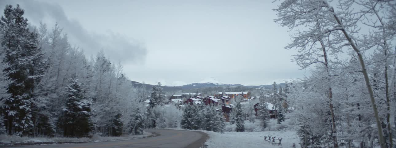 A wide shot of a snowy winter town