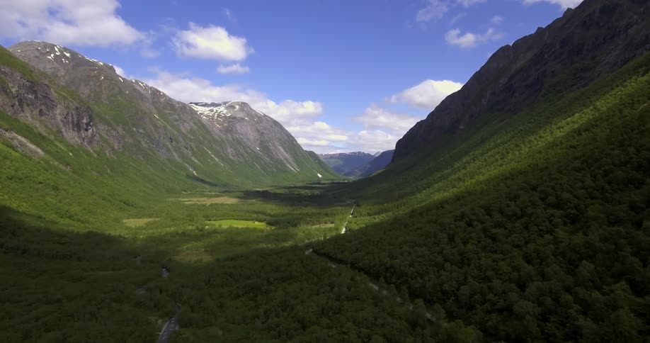 View between two mountains with heavy grass everywhere