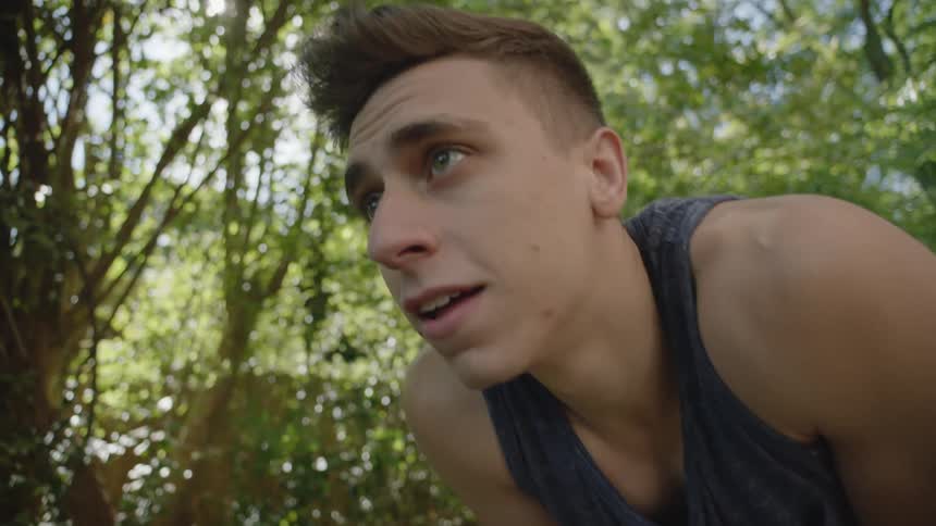 A man is exercising outdoors in spring