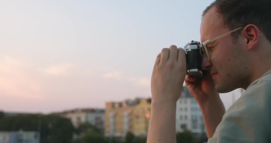 A man preparing to take a photo