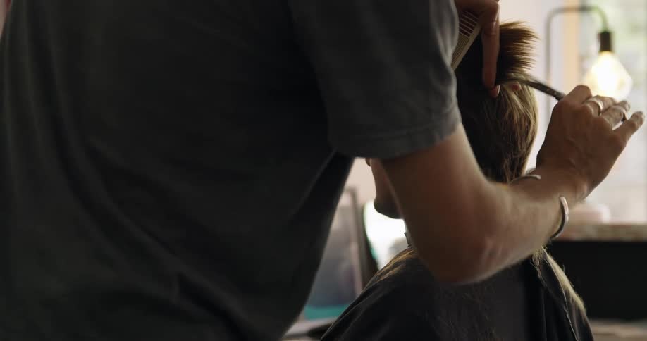 A man is getting a haircut